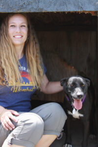 Dog trainer Ashleigh conducting a training session with a dog.